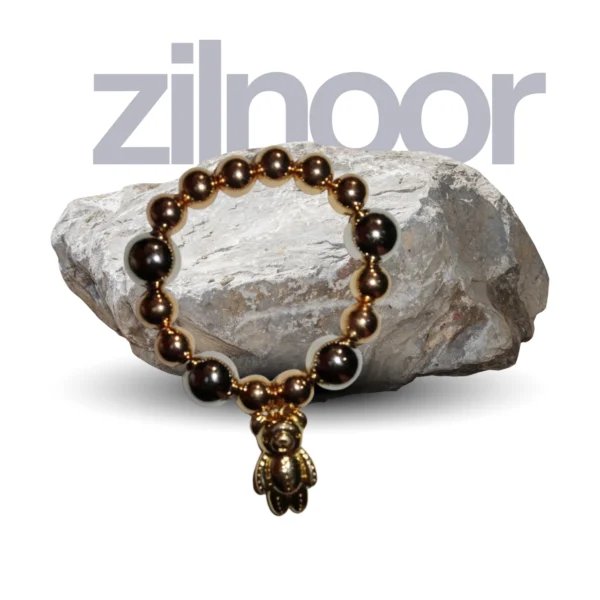 elegant gold beaded teddy charm bracelet